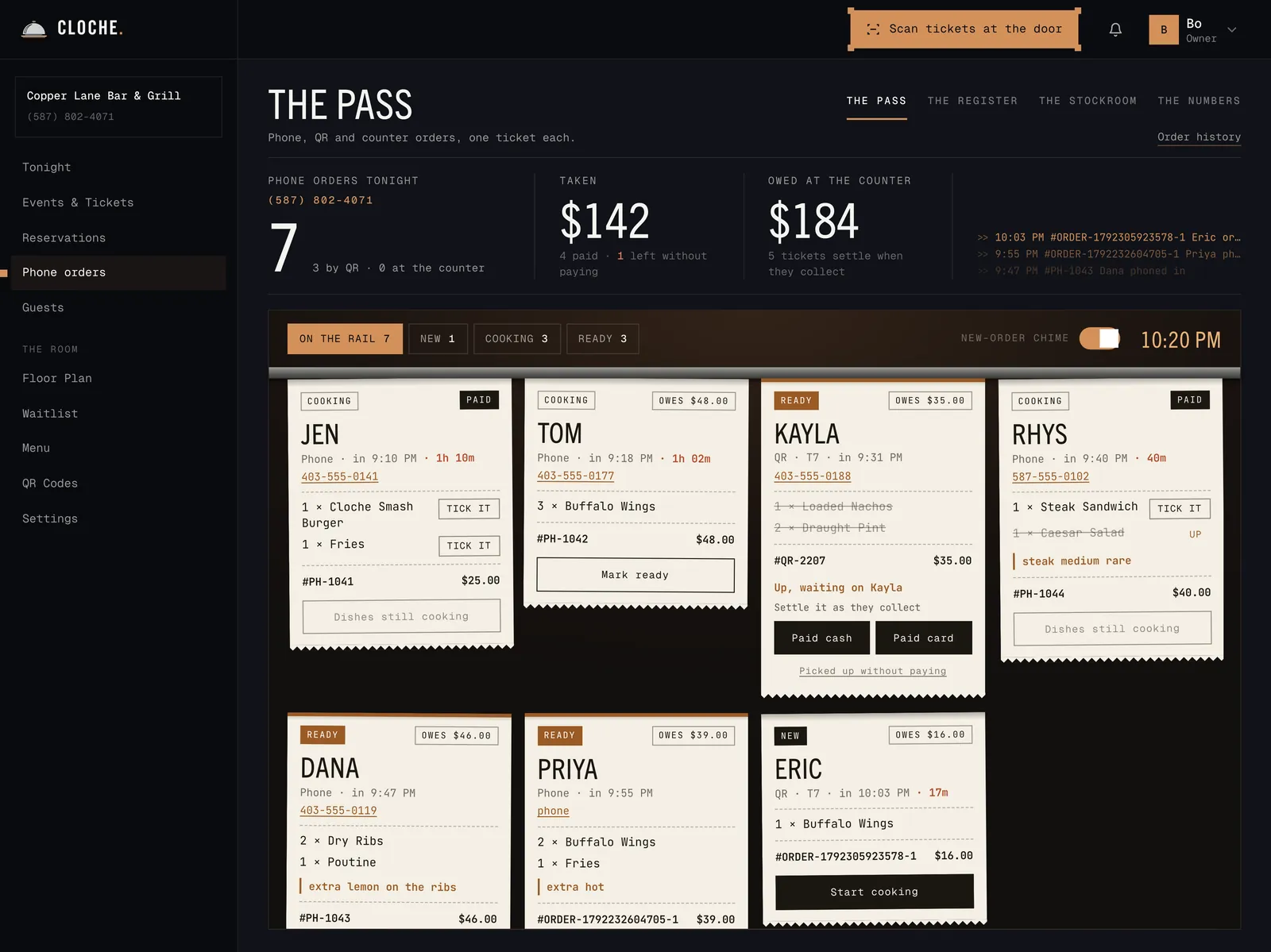 The pass: seven paper tickets on the rail, phone and QR orders, cooking, ready and new, paid and owed